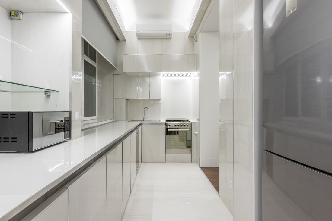 Bright white kitchen with clean worktops
