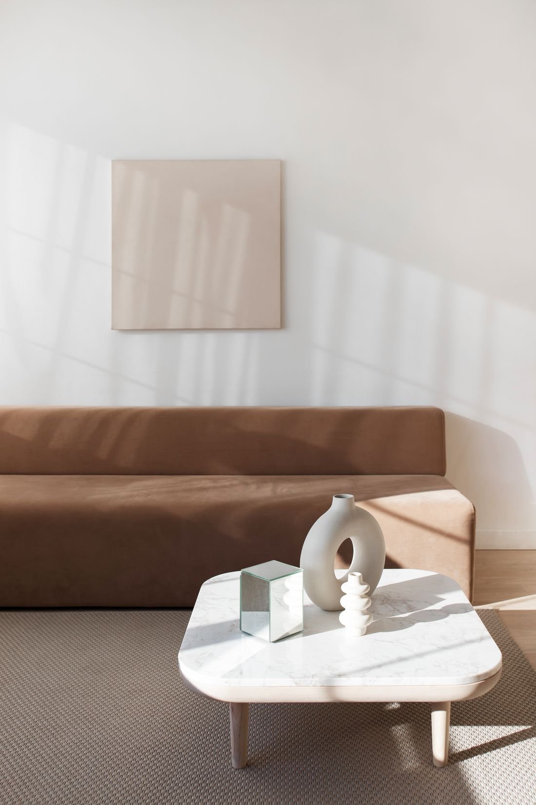 Minimal living room with sofa in natural light